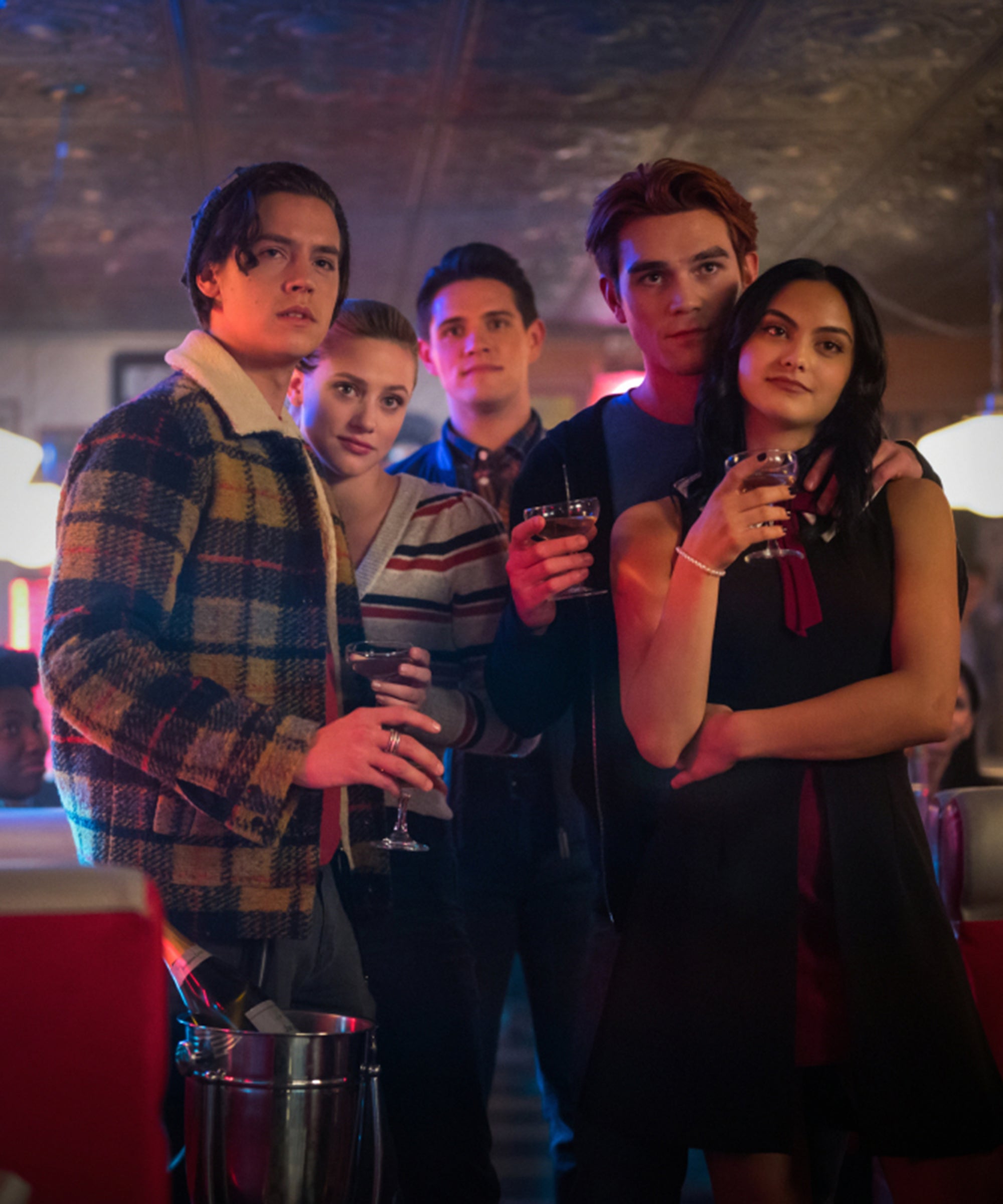 Jughead (Cole Sprouse), Betty (Lili Reinhart), Archie (KJ Apa), Veronica (Camila Mendes), and Kevin (Casey Cott) stand together