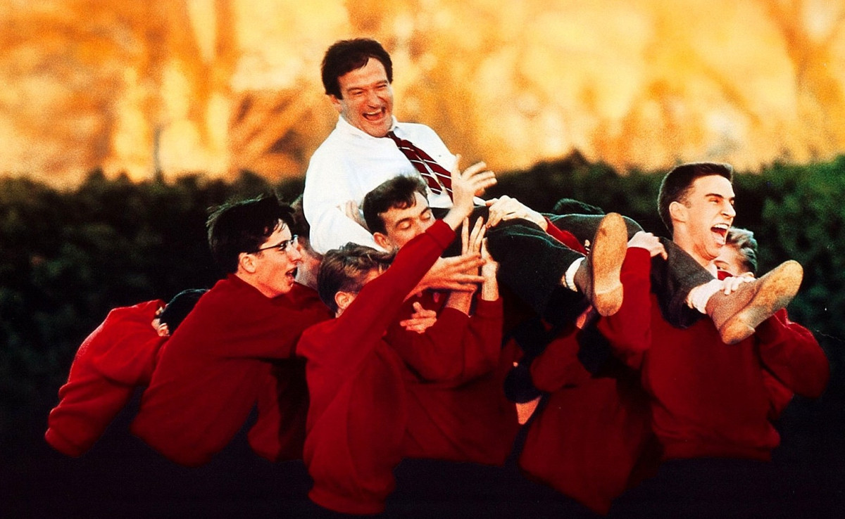 Mr. Keating's students lifting him up on their shoulders in "Dead Poet's Society" (Weir, Peter, dir. Dead Poets Society. 1989. Touchstone Pictures.).
