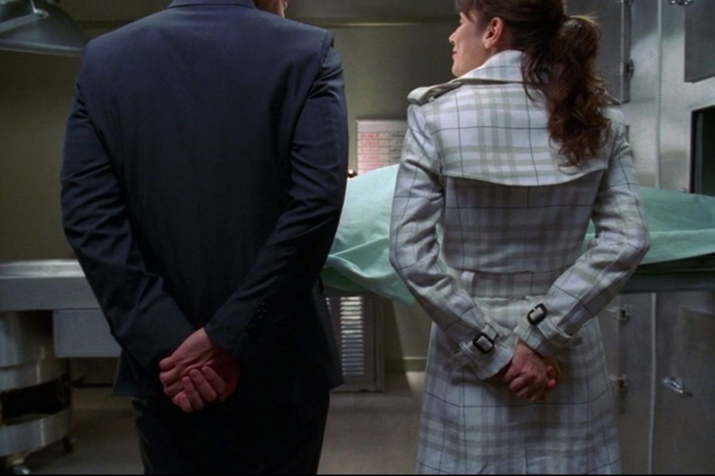 Ned (Lee Pace) and Chuck (Anna Friel) are pictured holding their own hands behind their backs. 

Pushing Daisies. Season 1, Episode 1: "Pie-Lette." 2007-2009. ABC.