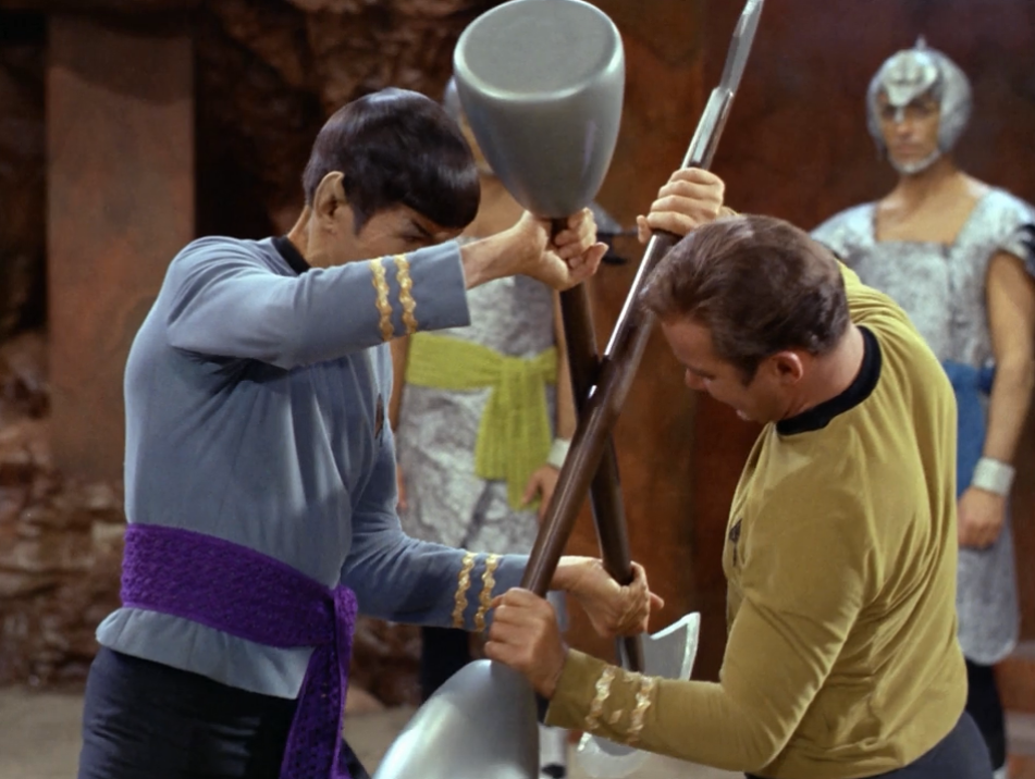 Image from Star Trek Original Series of Spock and Captain Kirk fighting with batons. 