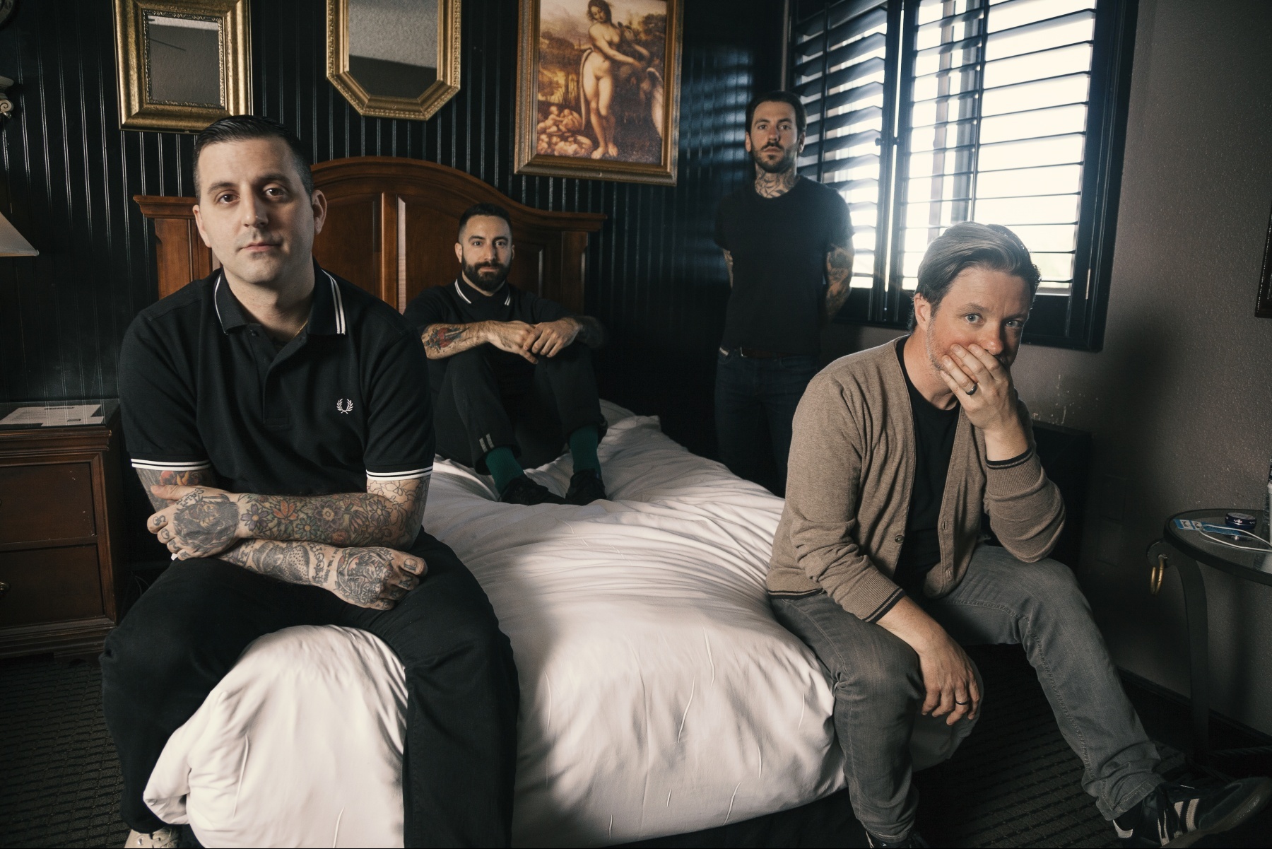 The members of Bayside pose in a vintage-looking hotel room (“Vacancy.” Bayside. 2016. Hopeless Records.).