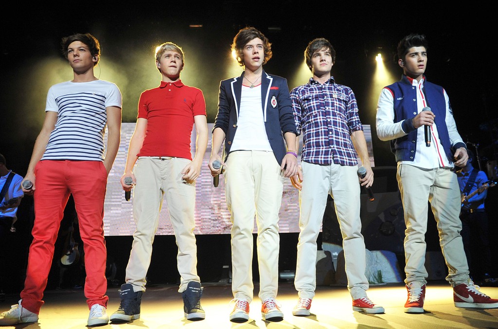 One Direction performs their concert in 2013.
