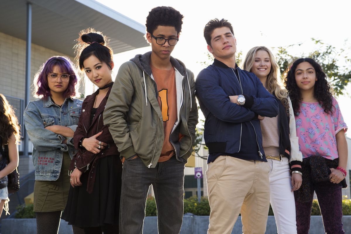 The cast of Marvel's Runaways stand in a line outside their school, from left to right: Gert, Nico, Alex, Chase, Karolina, and Molly. (Photo by Hulu.)