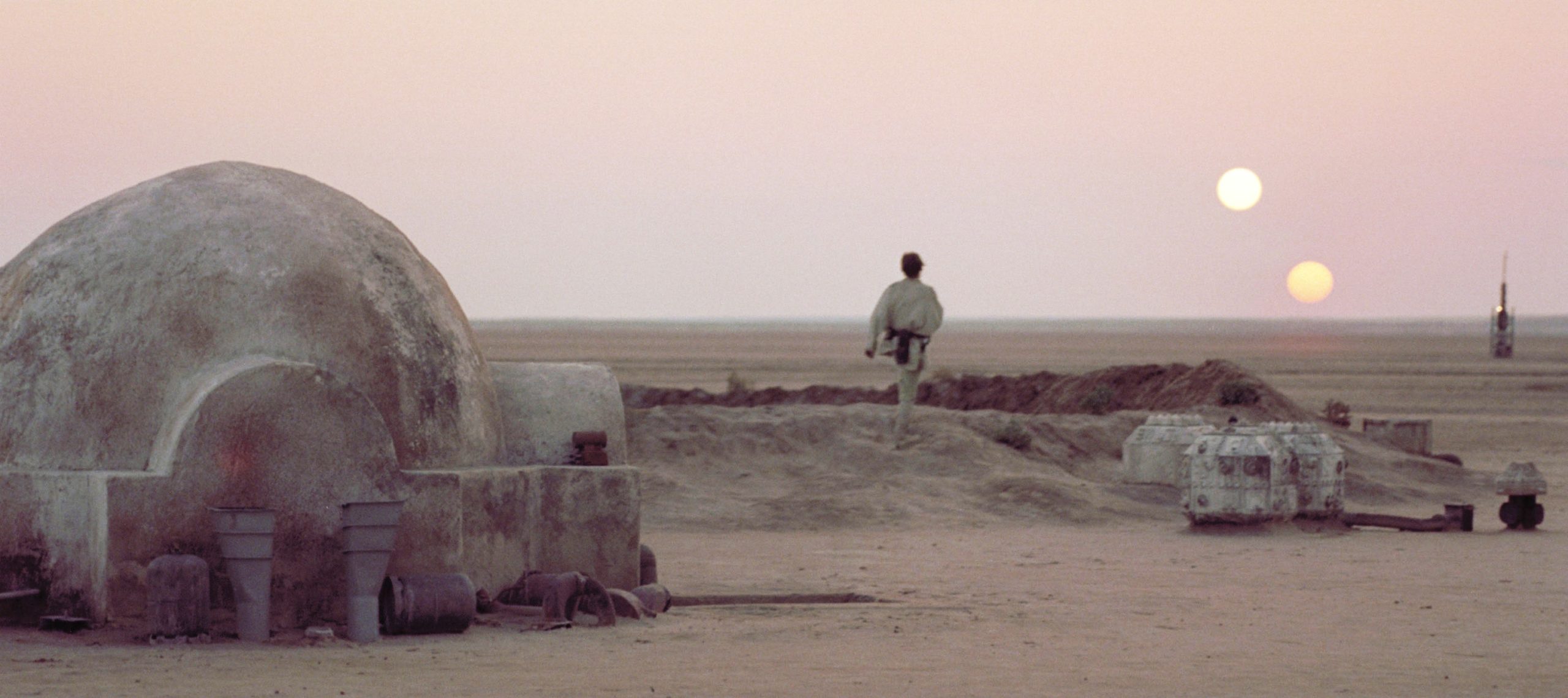 Luke Skywalker stares at the twin suns of Tatooine.