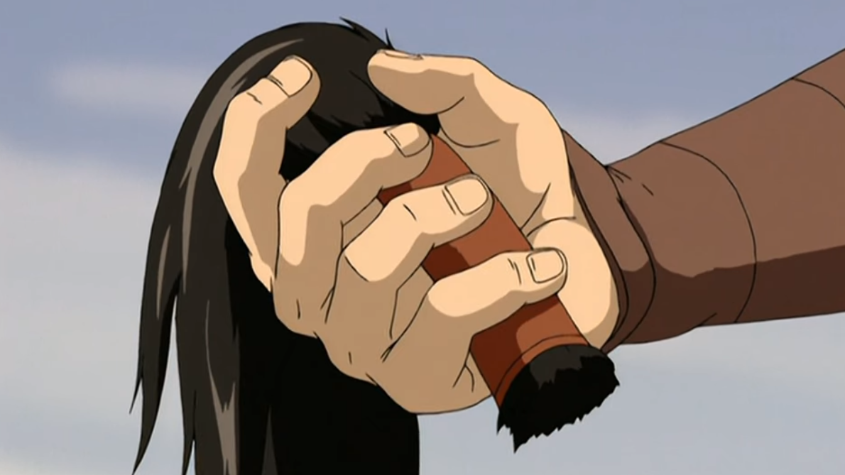 Zuko cuts off his ponytail.