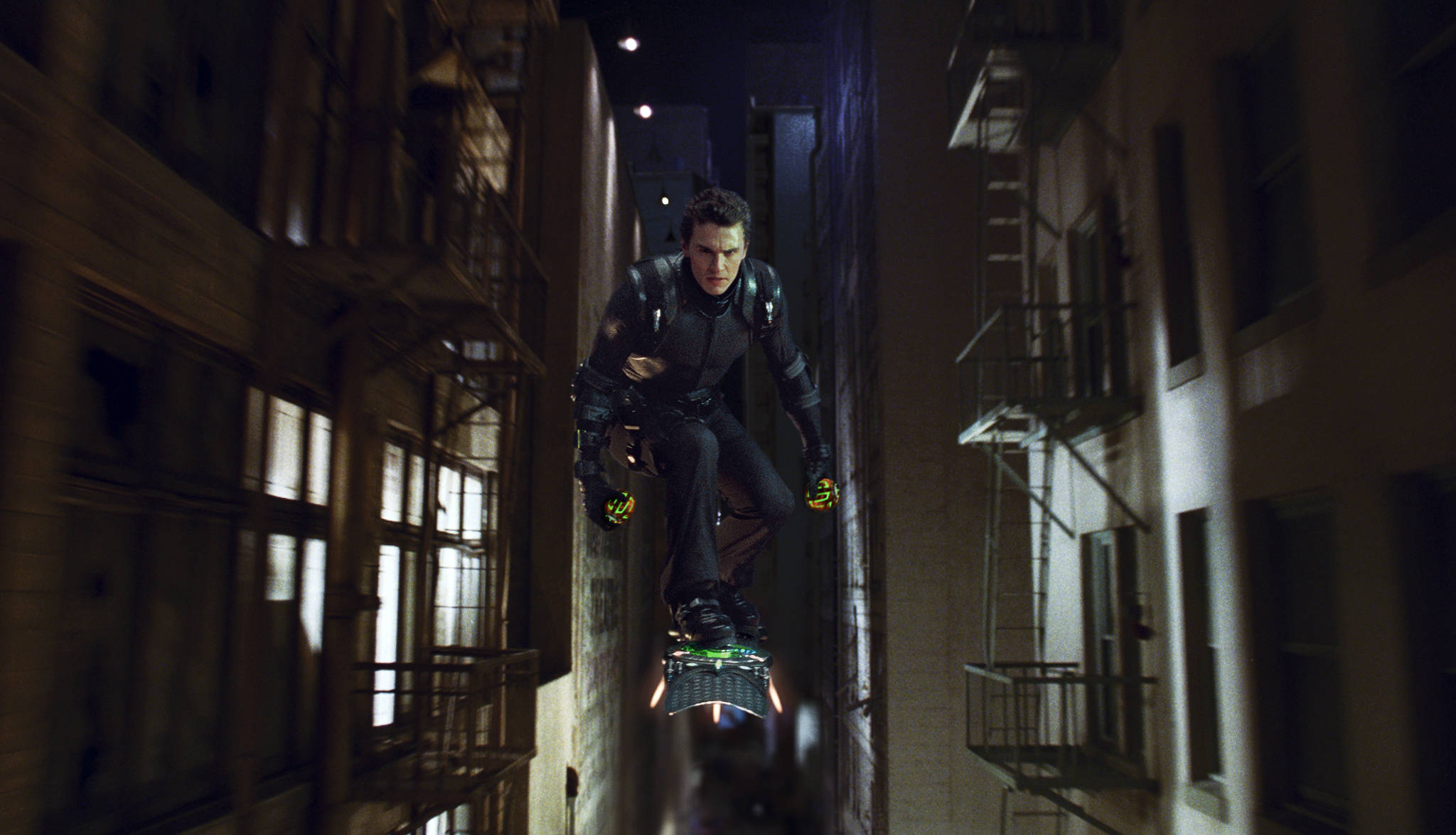 Raimi, Sam, dir. Spider-Man 3. 2007. New Goblin flies through a tight alleyway.