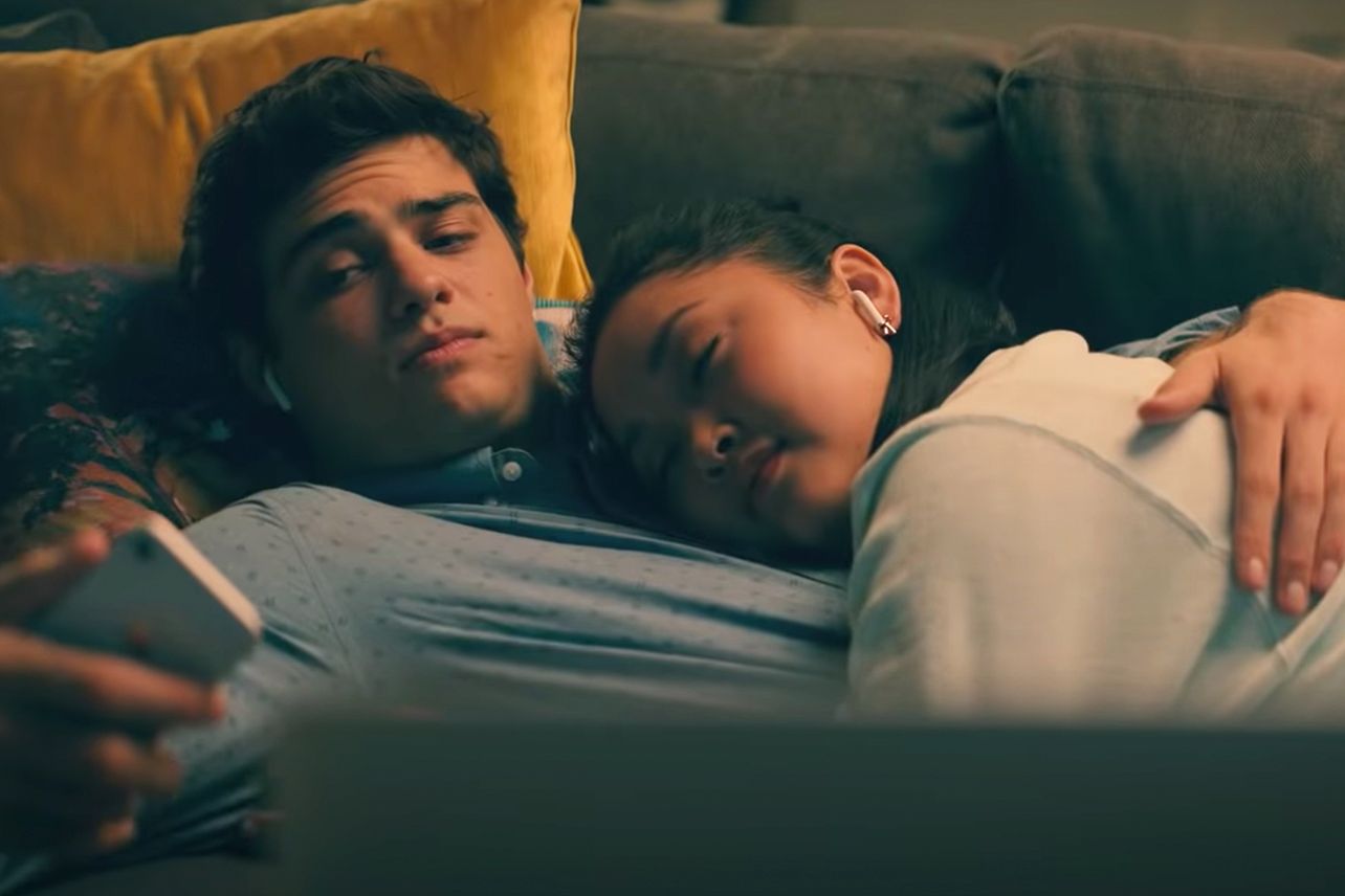 Our two main characters, Lara Jean and Peter Kavinsky, smile at each other