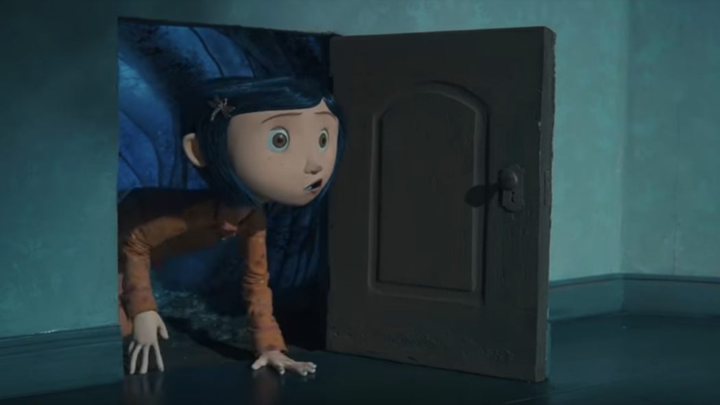 Coraline going through the secret door for the first time and entering the alternate reality.