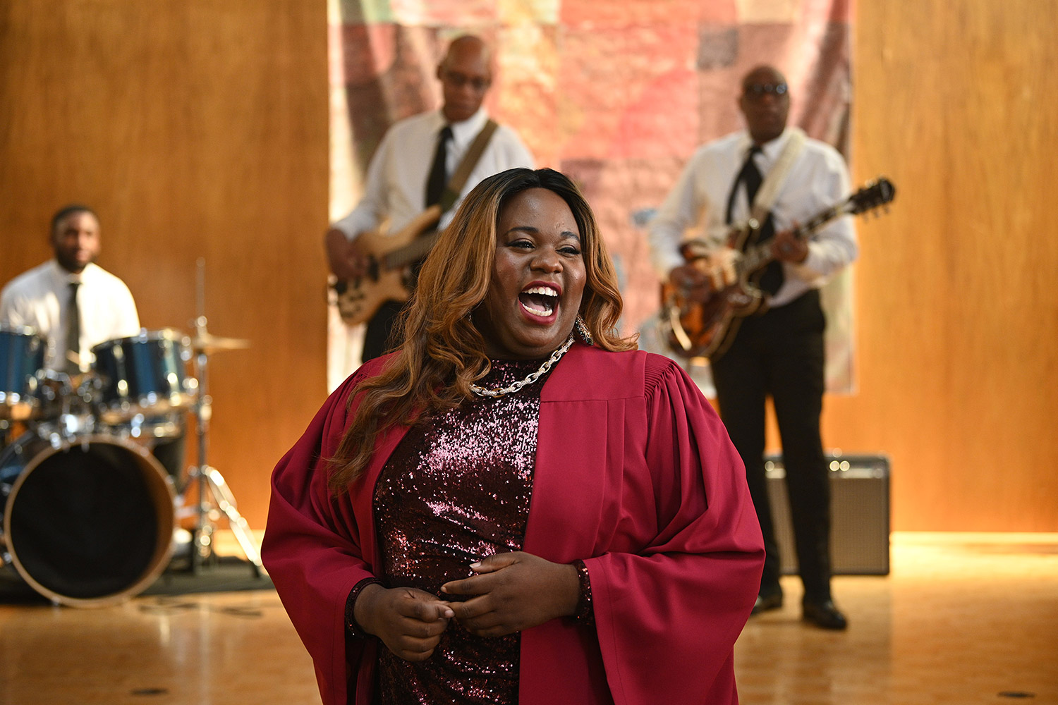 Mo sings joyfully in church in a shot from Zoey's Extraordinary Playlist, 2020-present (Photo by: Sergei Bachlakov/NBC).