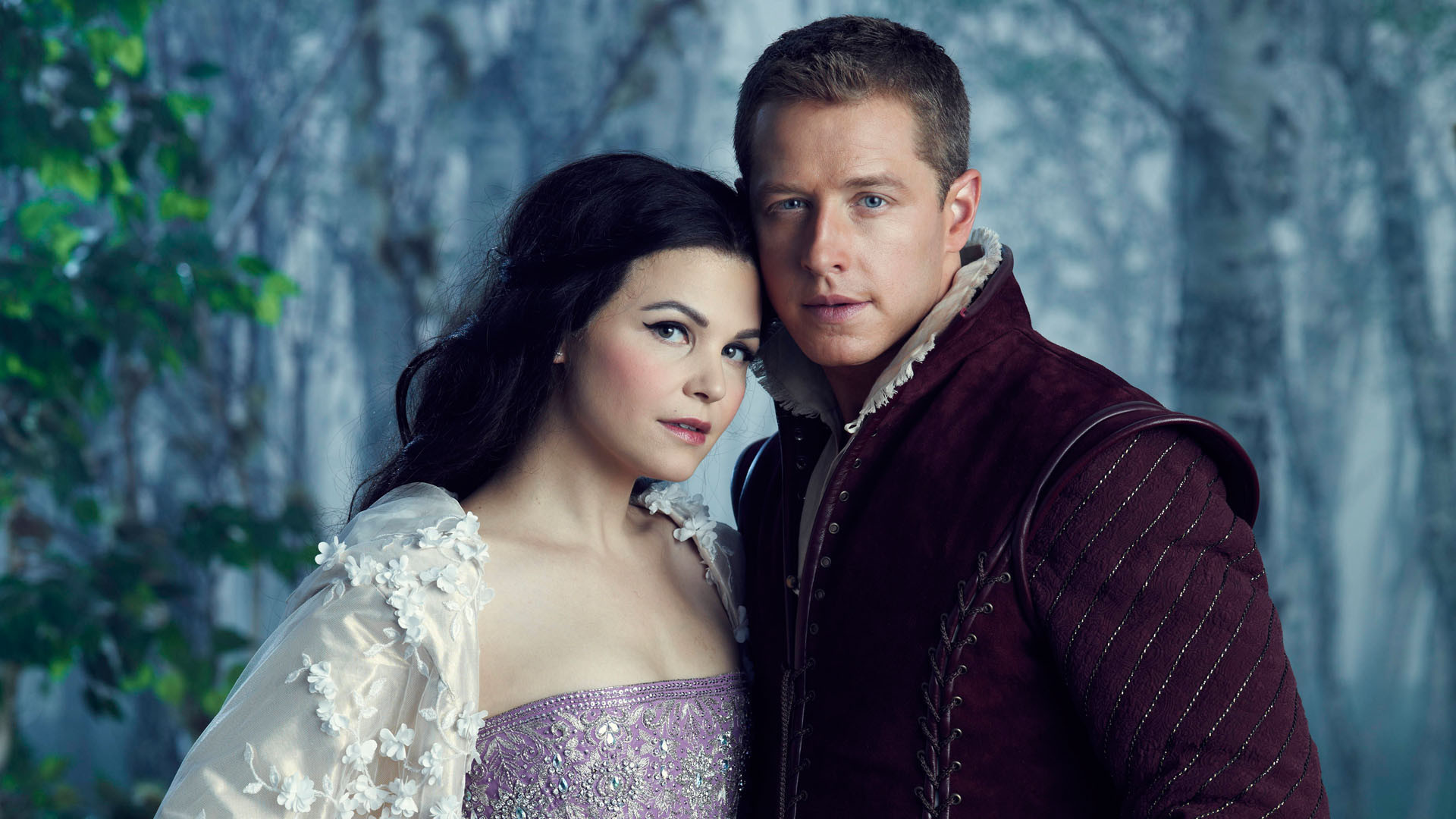 Snow White and Princes Charming are leaning on each other and looking intently at the camera.