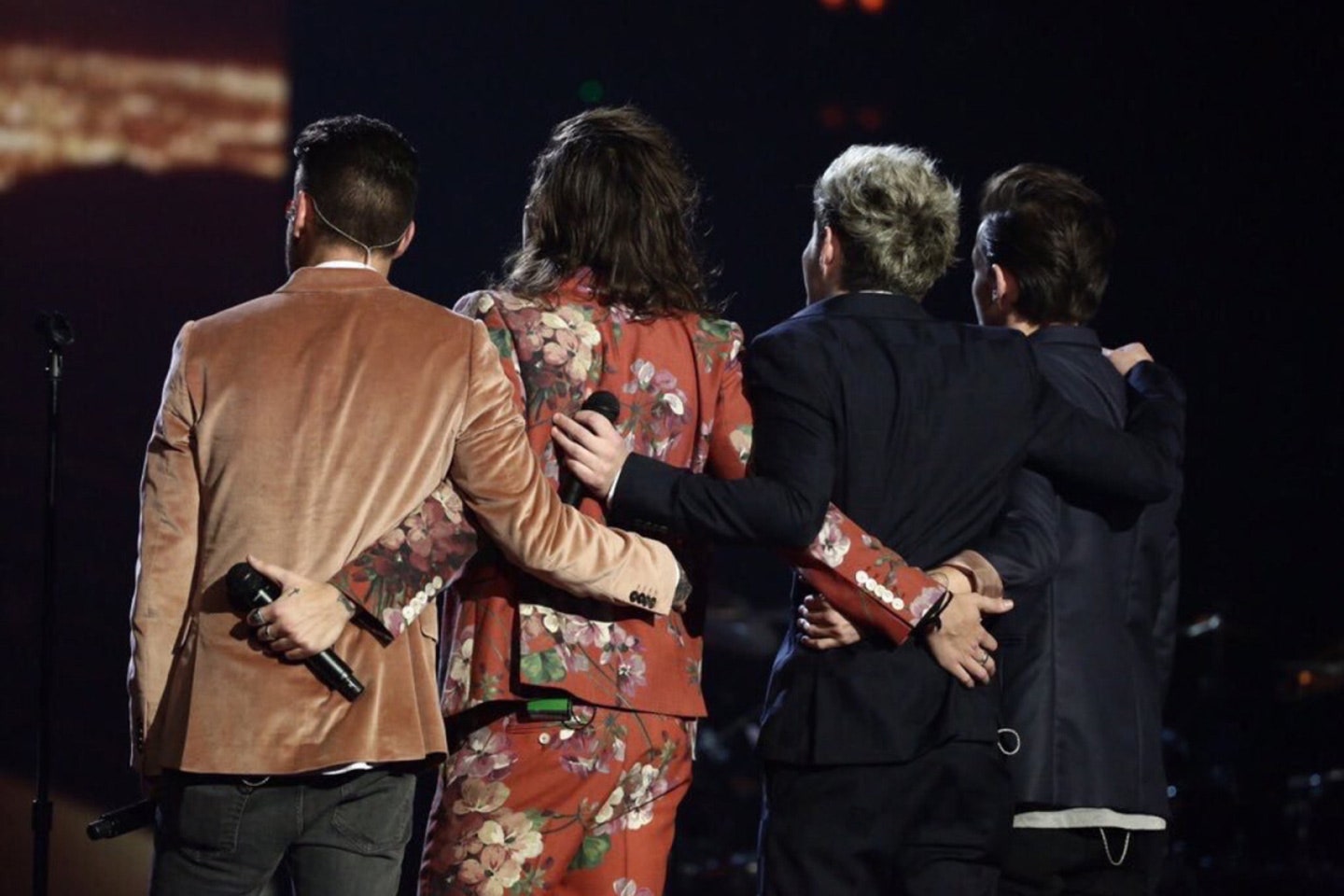 One Direction hugs during their last performance together in 2015.