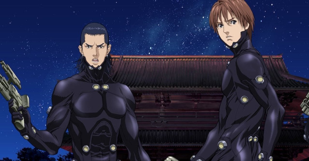 High school students, Kei Kurono and Masaru Kato wearing black body suits. 