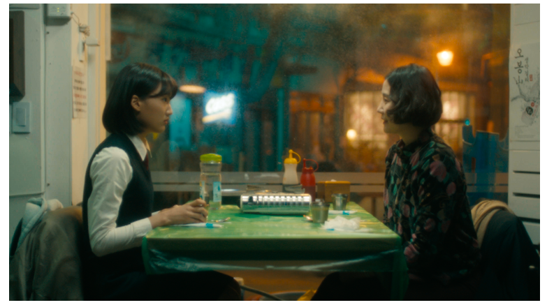 Yeonsoo (actress 
Do Eun Lee) sitting across from her mother (Chaewon Kim ) at a green restaurant table