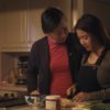 Parked in America; Jamie cutting vegetables with her grandma's arm around her shoulder