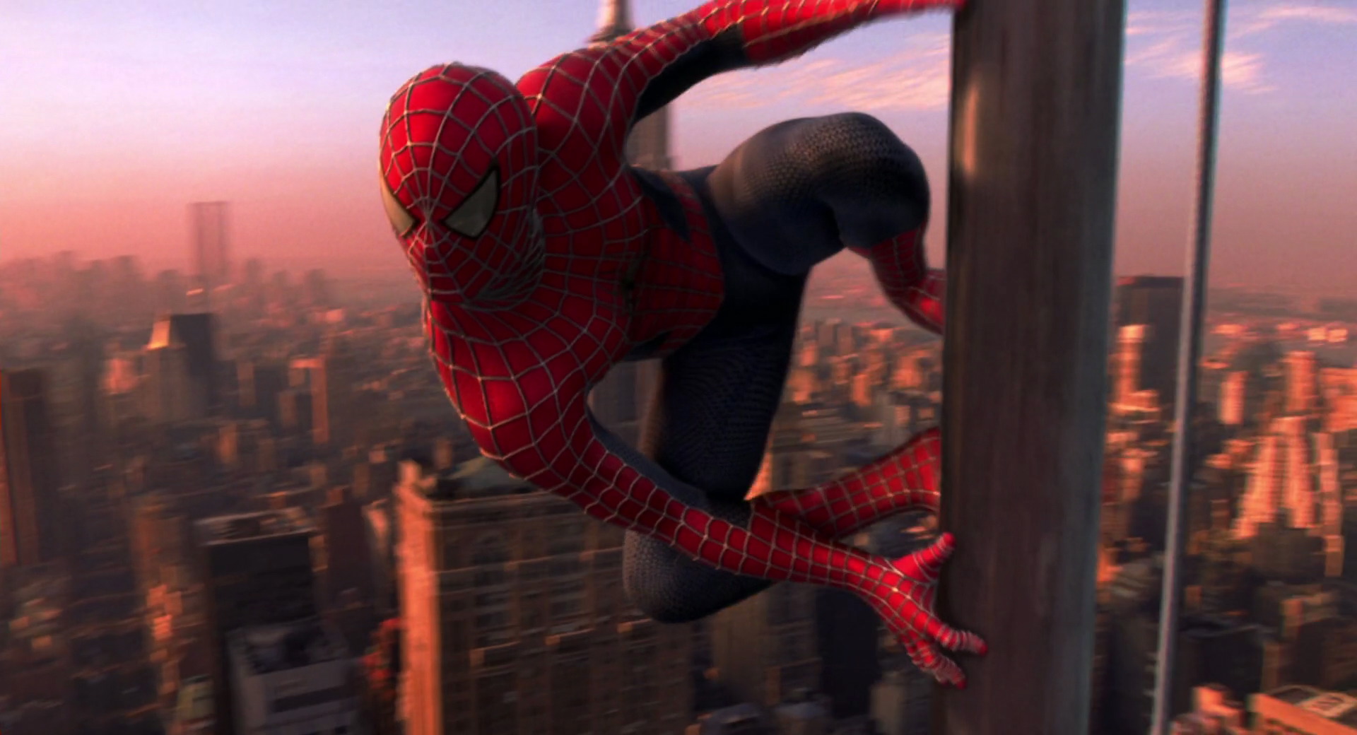 Raimi, Sam, dir. Spider-Man. 2002. Spider-Man prepares to launch from a flagpole atop a skyscraper.