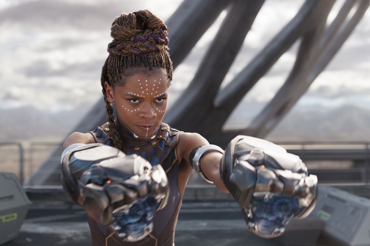 Here, Shuri is seen aiming her self-made gauntlets at Killmonger in Black Panther (2018).