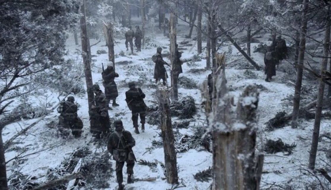 American soldiers move through the damage caused by German shelling. (Photo by HBO)