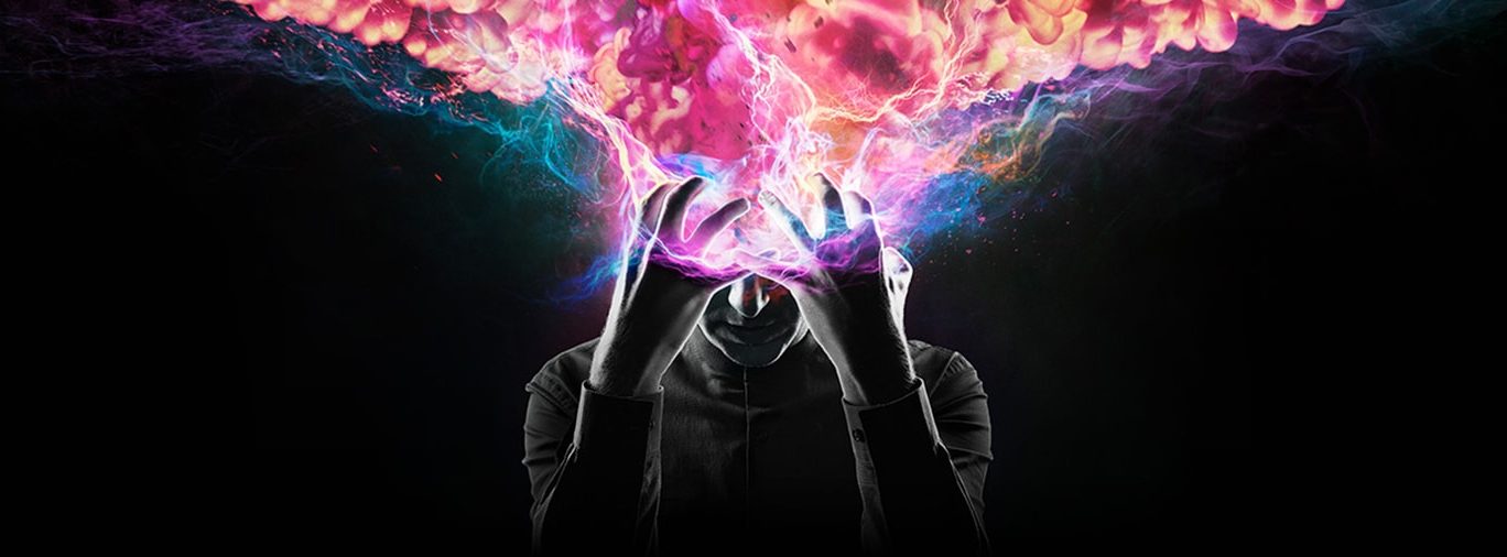 A promotional image of FX's Legion, showing David as a vague figure, clasping his head, from which the galaxy seems to be emerging in a cloud-like shape. (Photo by FX and Marvel.)