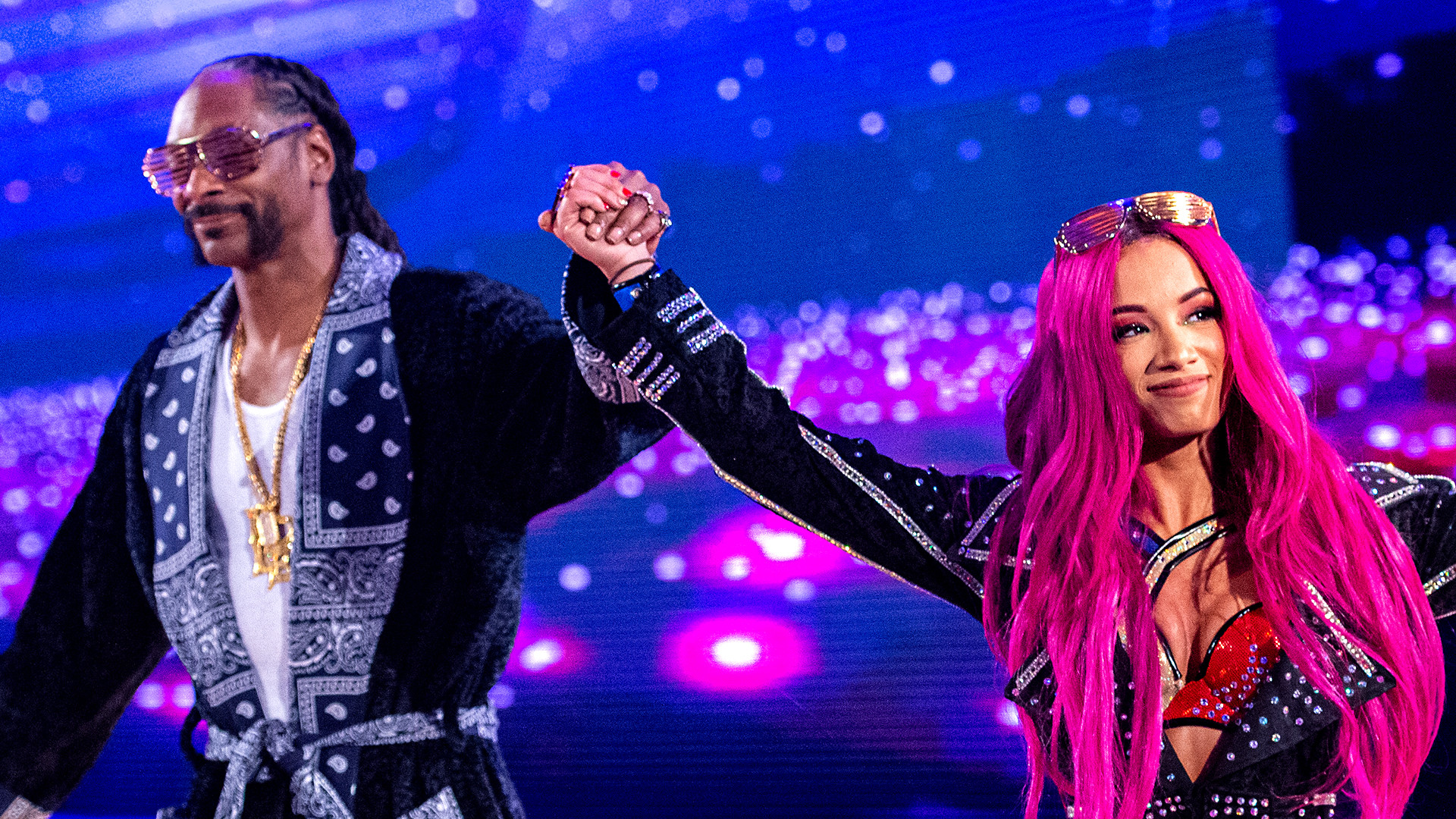 Snoop Dogg accompanying Sasha Banks to the ring at WWE's Wrestlemania 32.