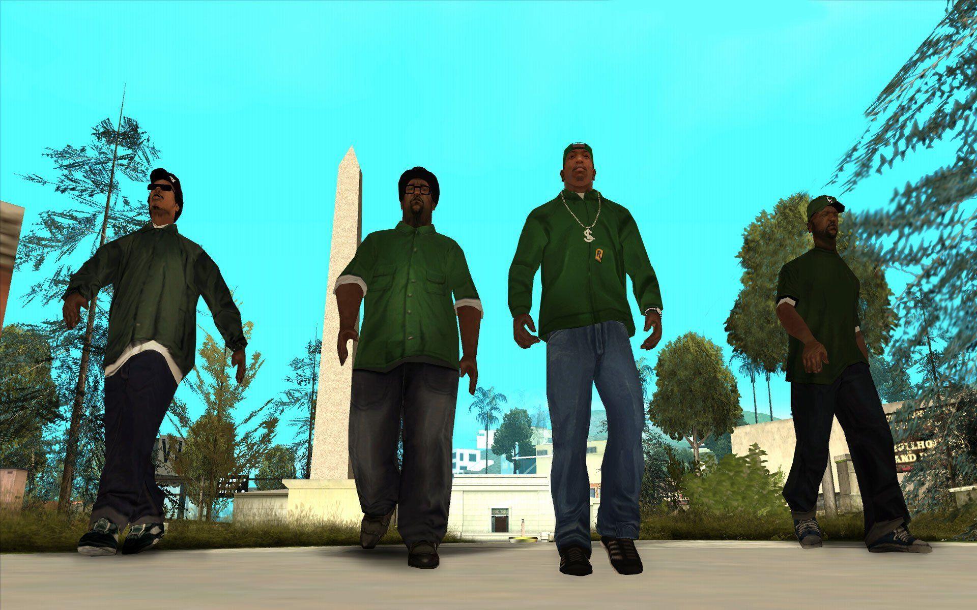 The four main characters of "San Andreas," all wearing green shirts, walk in a line.