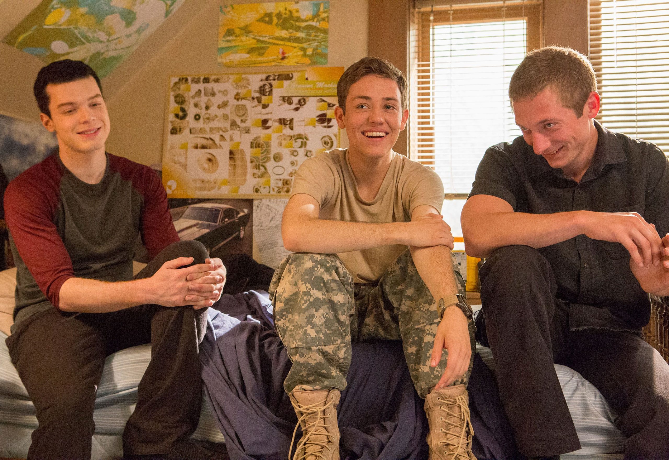 Carl Gallagher, Ian Gallagher, and Lip Gallagher sitting in their room laughing.