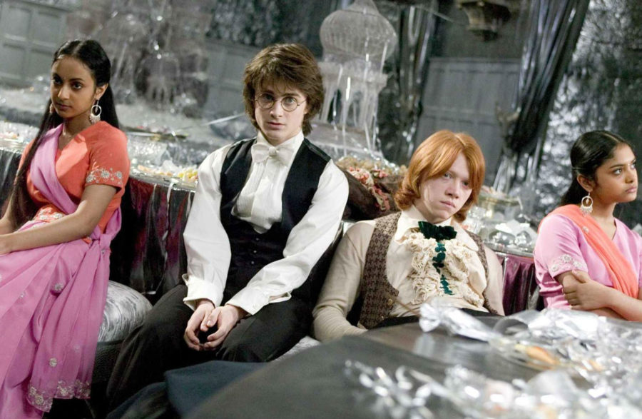 Harry and Ron sit in tense silence during the ball. 