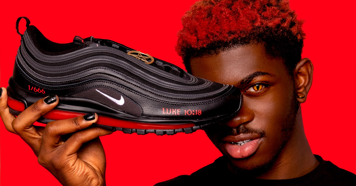 Lil Nas X showcasing his Air Max 97 sneaker made with MSCHF.