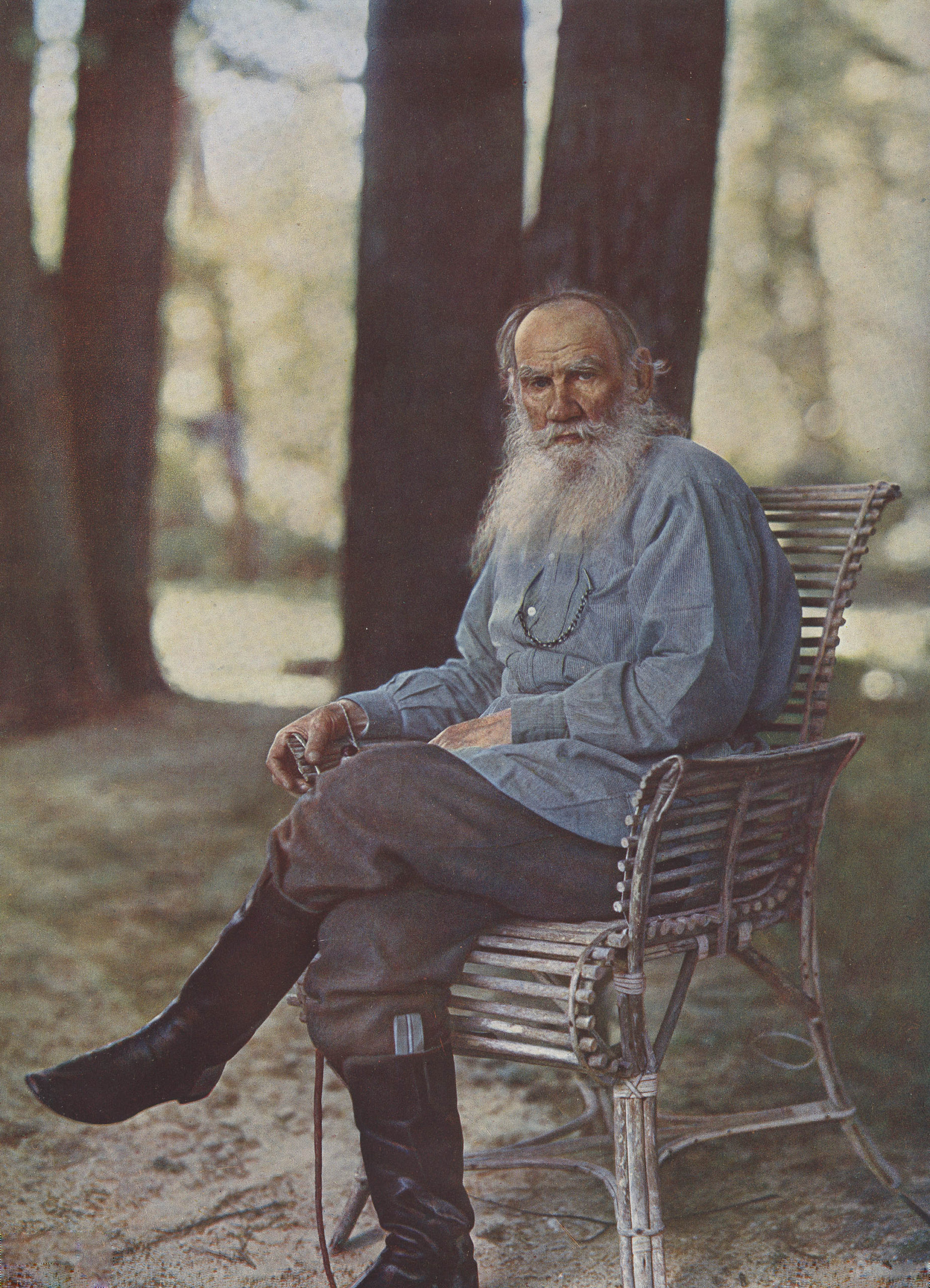 Leo Tolstoy sits on a bench in the first color photo portrait in Russia, 1908 (Litograph print by Sergey Prokudin-Gorsky).