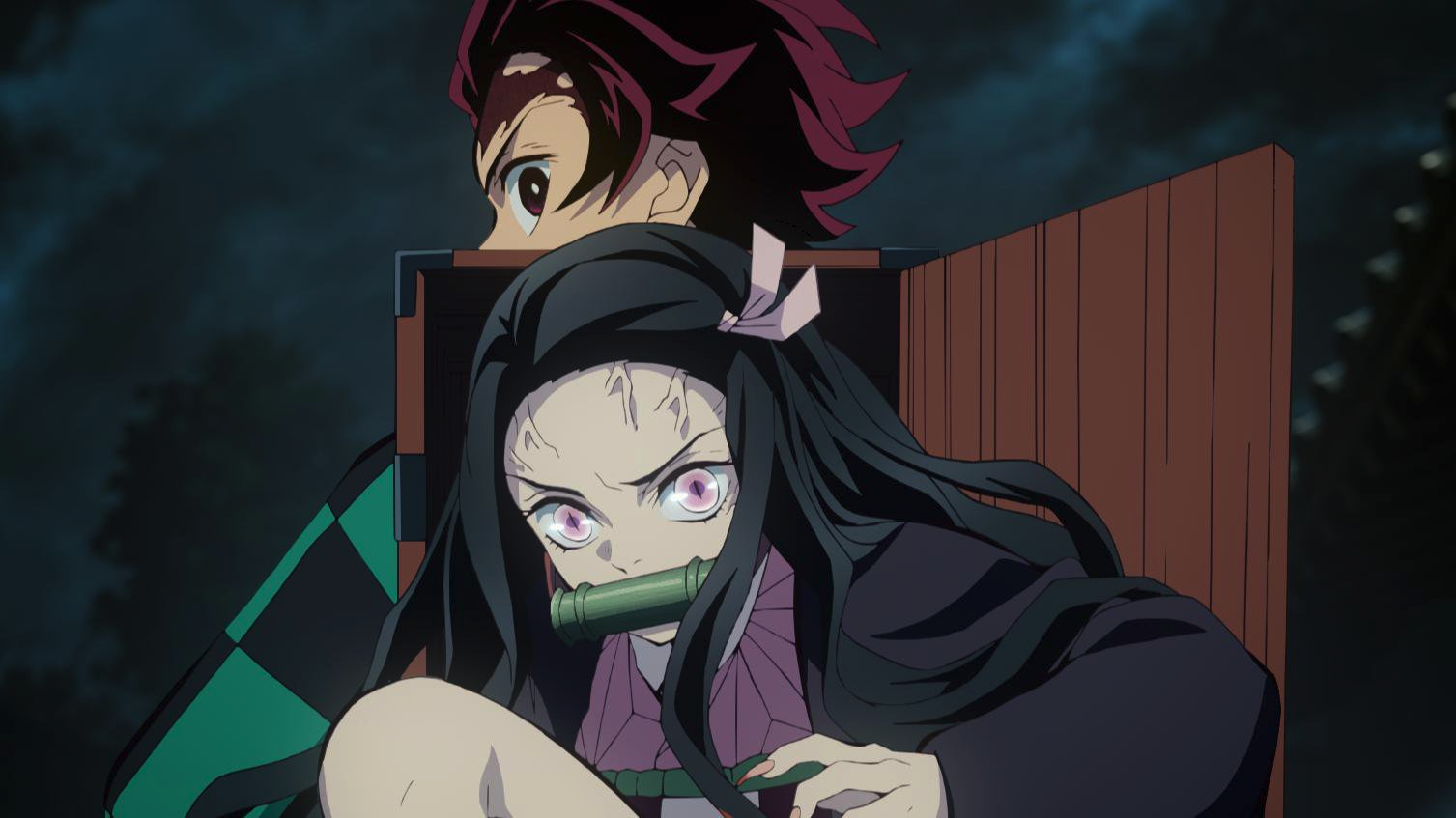 Tanjiro and sister Nezuko stand back to back as they prepare to fight off demons together. 