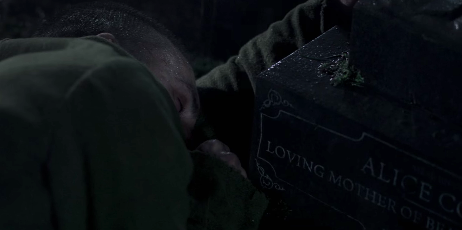 Sherlock Holmes lays beside Alice's gravestone. 