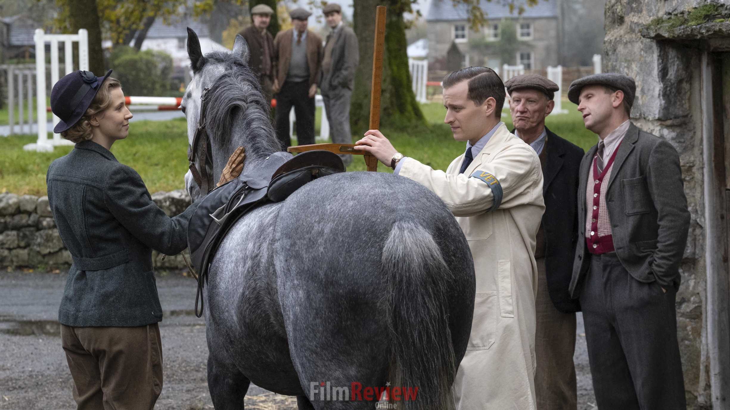 James Herriot measures a horse in a shot from All Creatures Great and Small, 2020. (Photo by Playground Entertainment/PBS).
