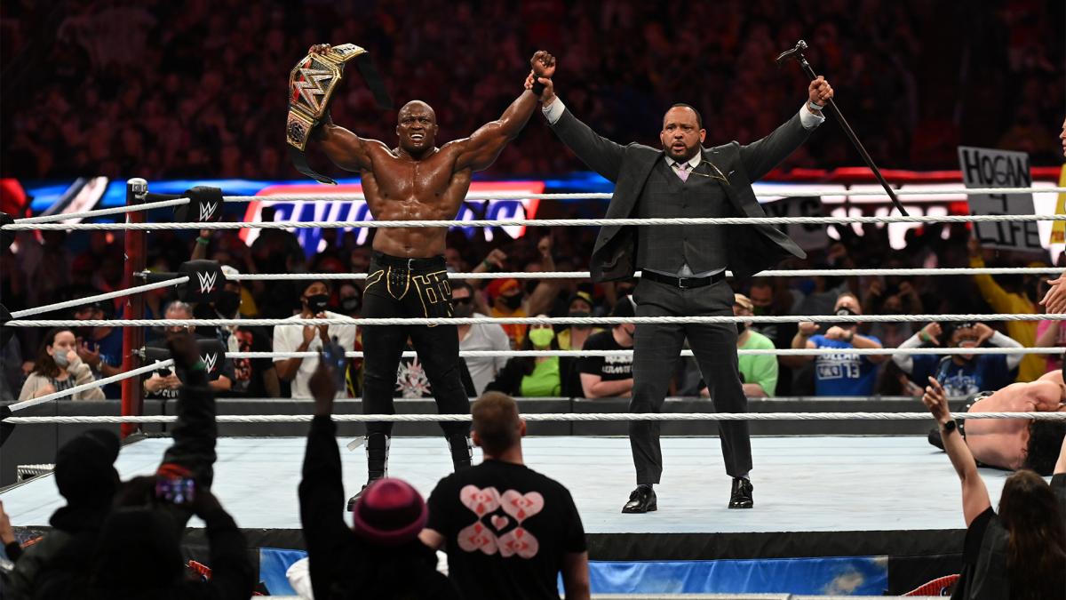 Bobby Lashley and MVP celebrating their victory at Night One of WrestleMania 37 in front of a live audience (WrestleMania 37. 1972-Present. World Wrestling Entertainment.).