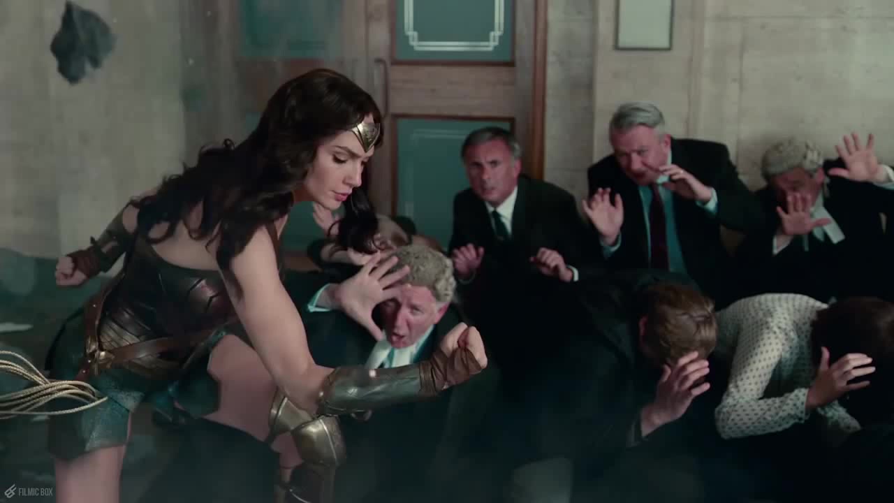 Wonder Woman saving civilians at a bank (Source: Warner Bros). 