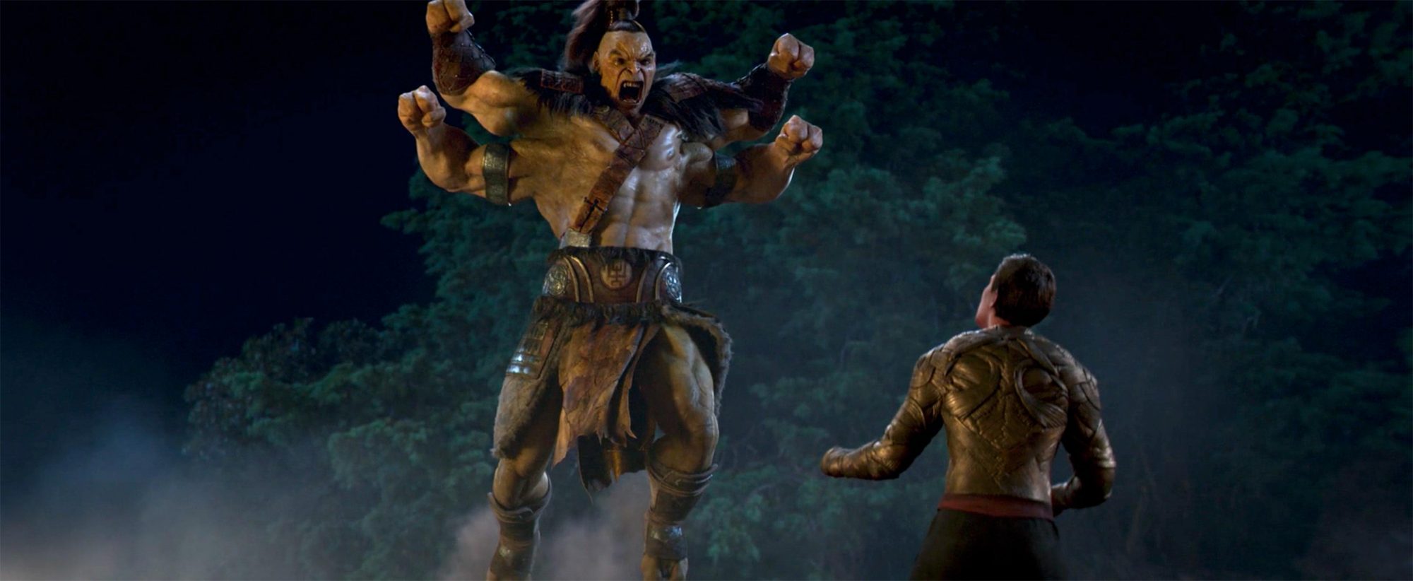 Angus Sampson as Prince Goro fighting Lewis Tan as Cole Young in Mortal Kombat (2021). 