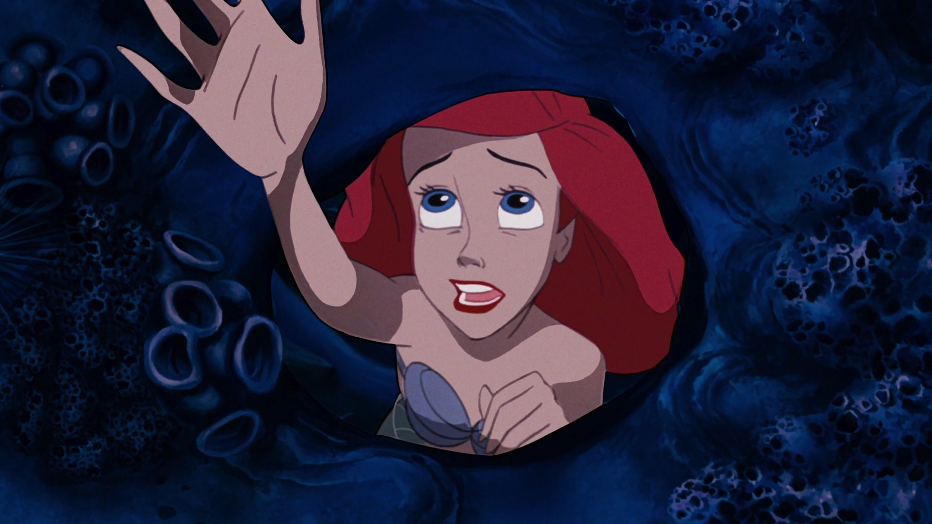 Ariel reaching for the surface at the end of 'Part of Your World.' 