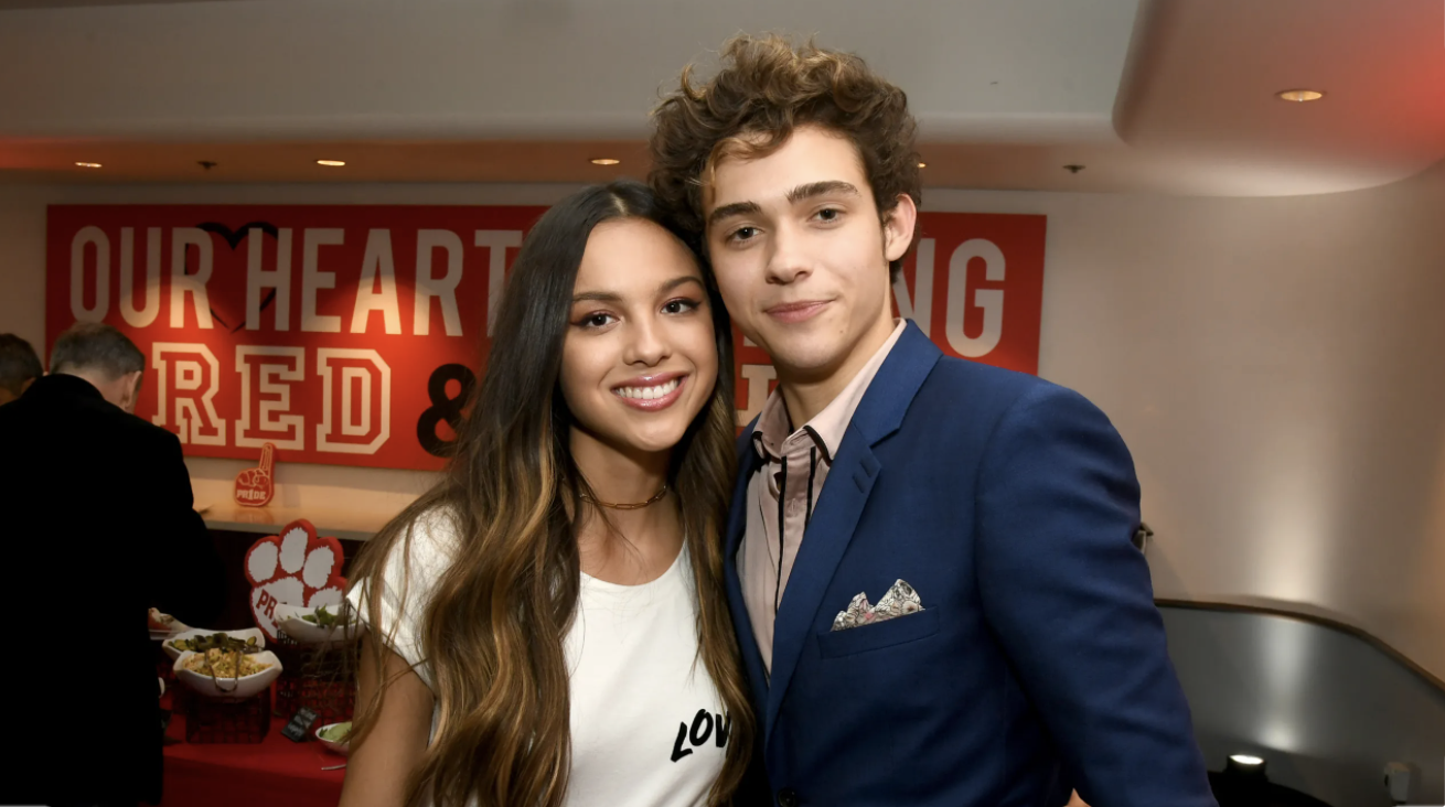 Olivia Rodrigo and her co-star Joshua Basset pose for a picture with each other at the after-party for the premiere of their Disney Plus show, High School Musical: The Musical: The Series.