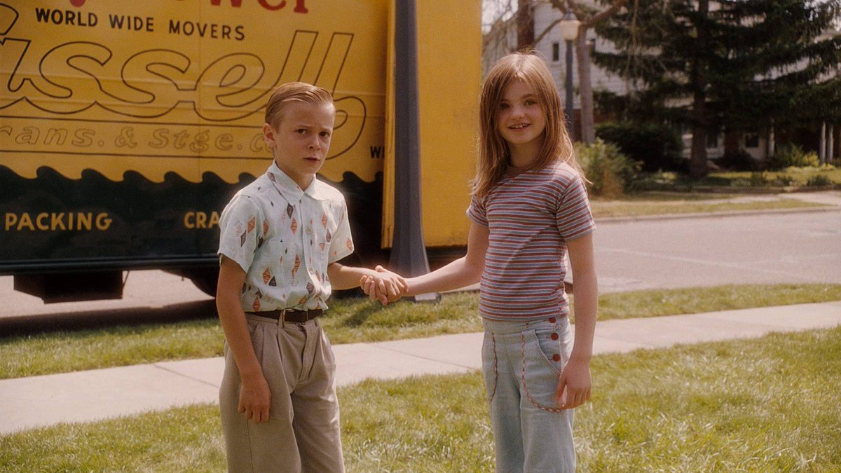 Young Juli and Bryce standing together after Bryce moves into the neighborhood. 