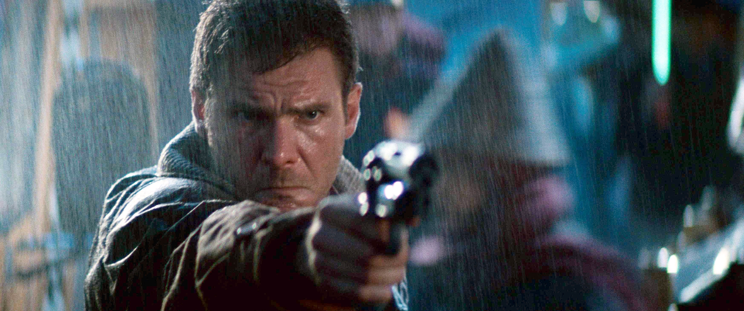 Rick Deckard aims a gun in Blade Runner (1982).