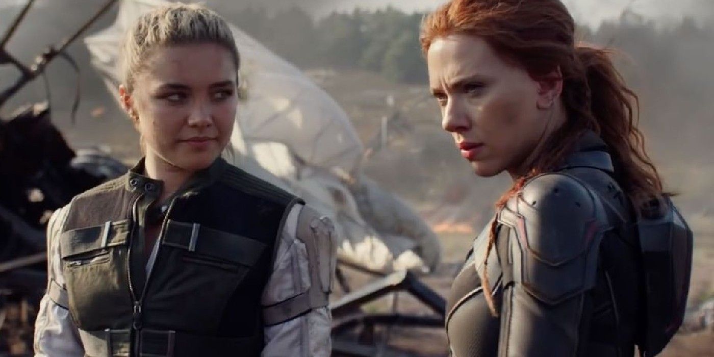 Florence Pugh as Yelena Belova (wearing her favorite green vest) and Scarlett Johansson as Natasha Romanoff among the wreckage of a battle in Black Widow (2021).
