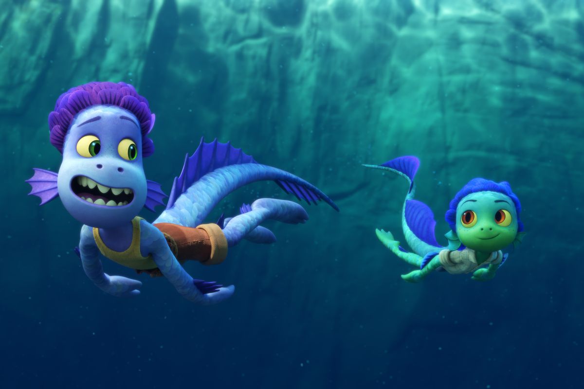 Luca and Alberto swim underwater in their sea monster forms.