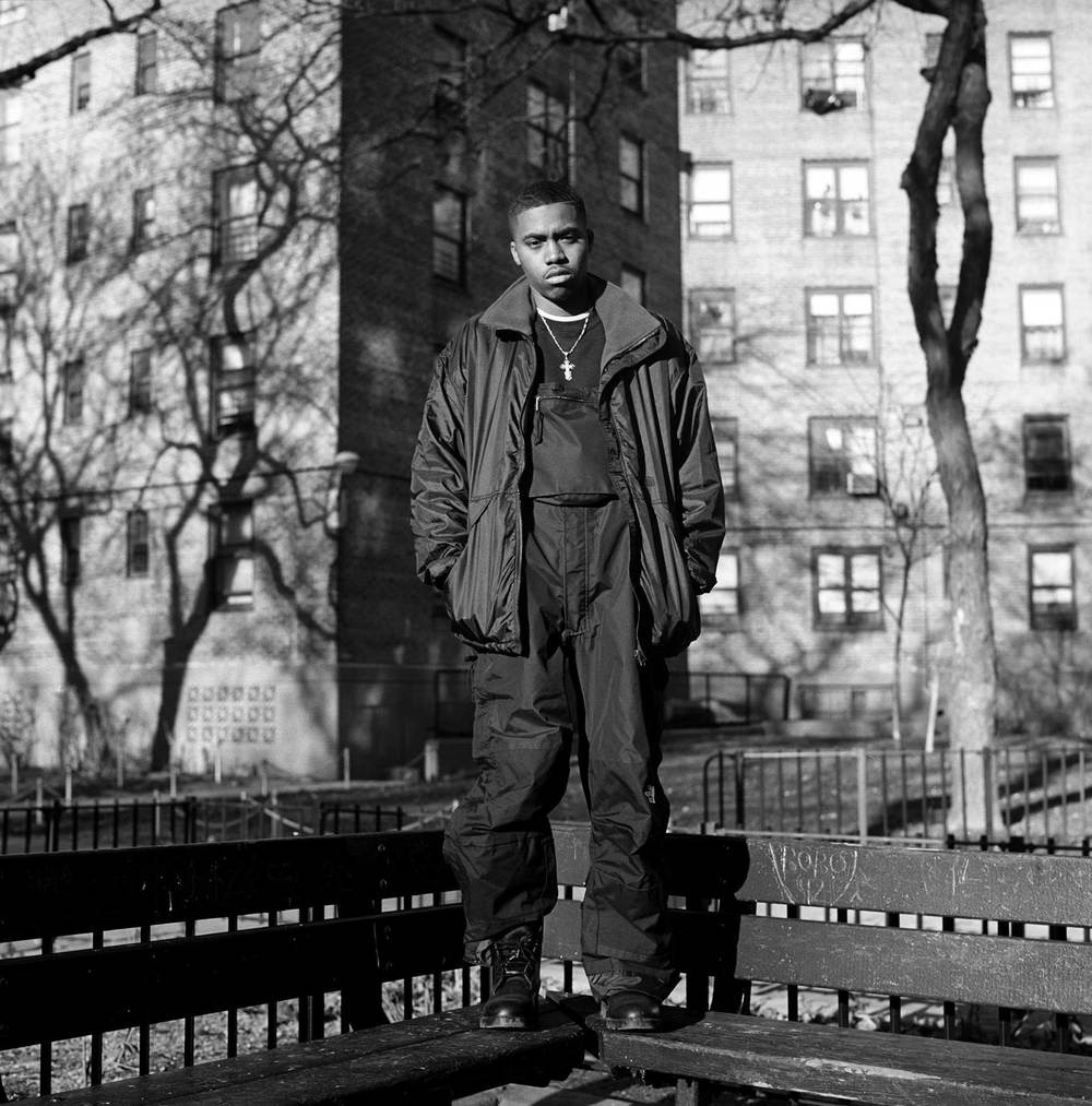 Nas standing atop benches in Queensbridge. 