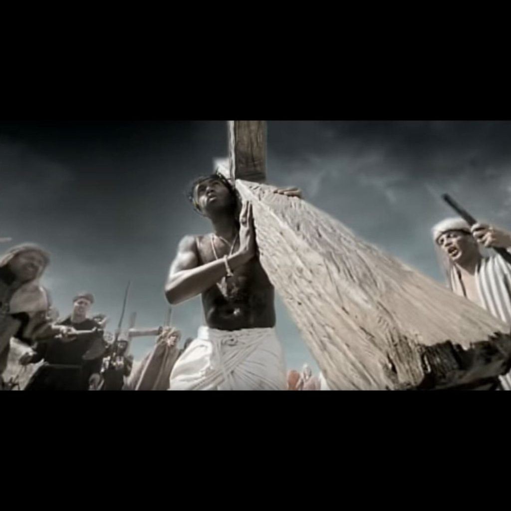 Nas is carrying the cross, likening himself to Jesus in the music video for "Hate Me Now". 