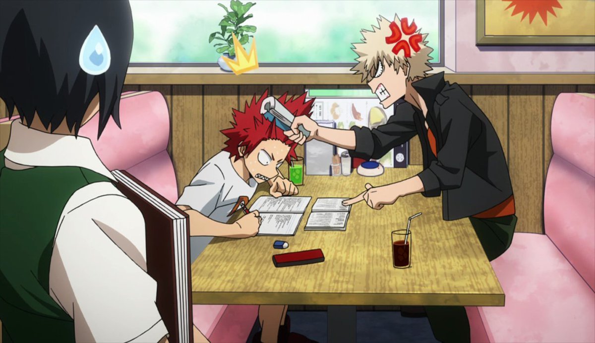Bakugo helping his friend Kirishima study, using rough means. 