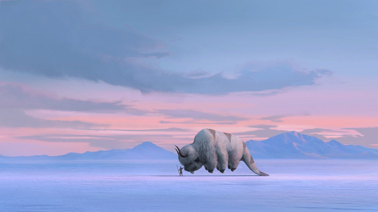 Aang stands in the snow with his sky bison, Appa.