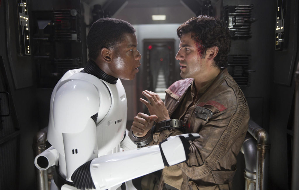 Finn (FN-2187) and Poe Dameron confiding in one another in Star Wars: The Force Awakens (2015).