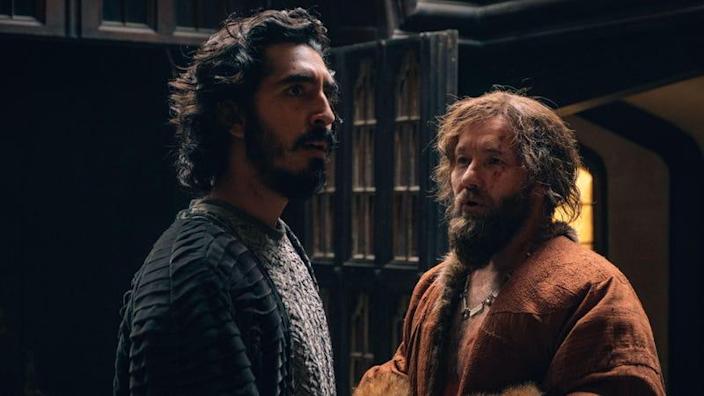 Dev Patel as Sir Gawain and Joel Edgerton as the Lord in The Green Knight (2021).