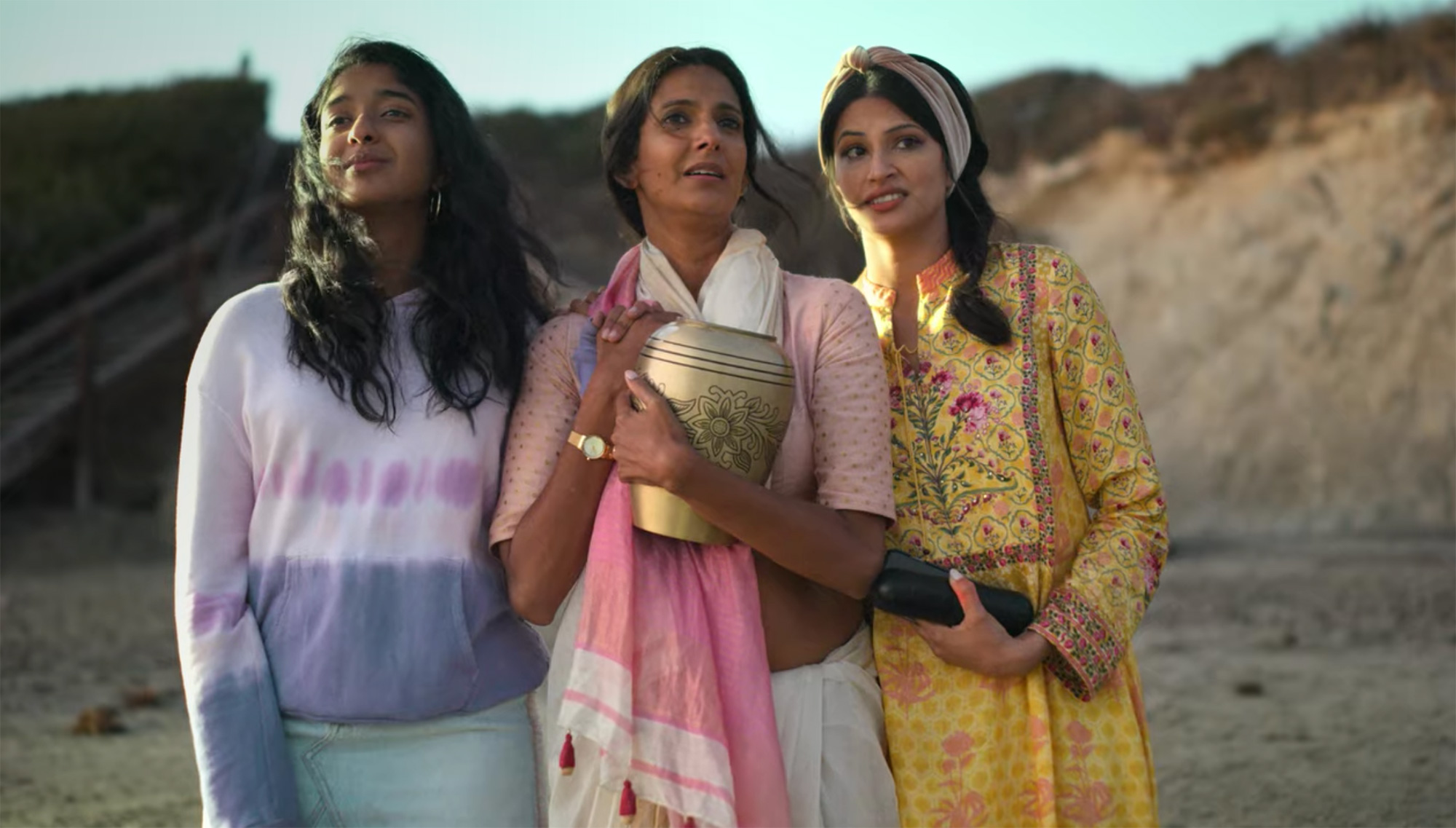 Devi joins her mom and cousin, Kamala, on the beach to spread her dad's ashes. 