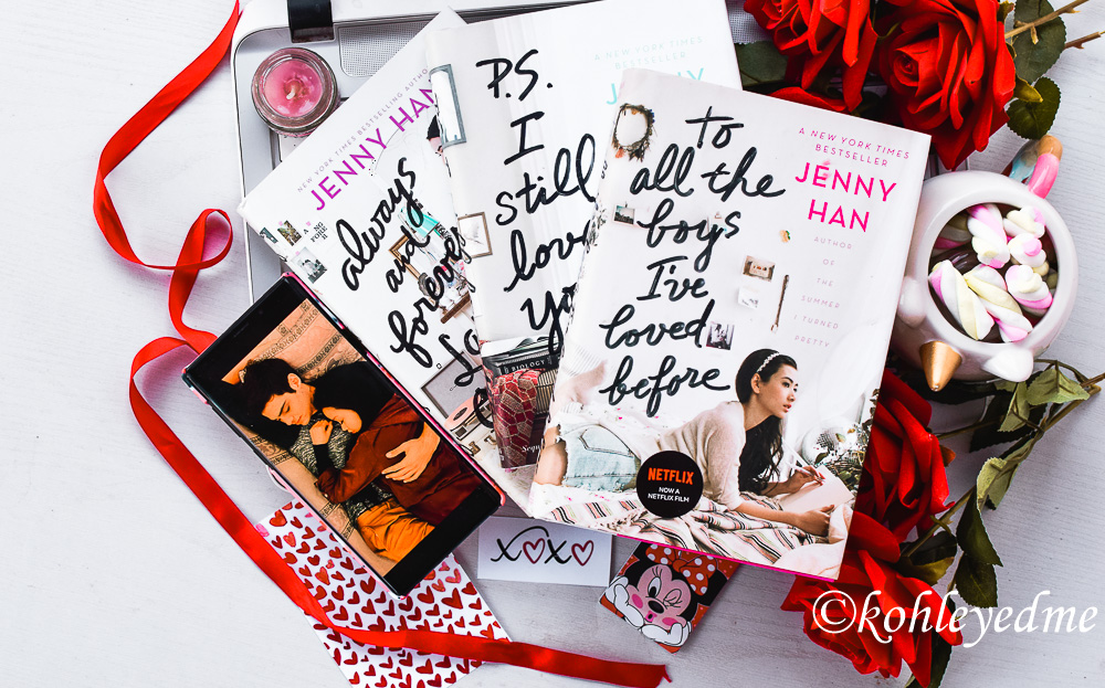 A photo shows a picture of books written by Jenny Han surrounded by roses. @kohleyedme." To All the Boys I've Loved Before. 2020.