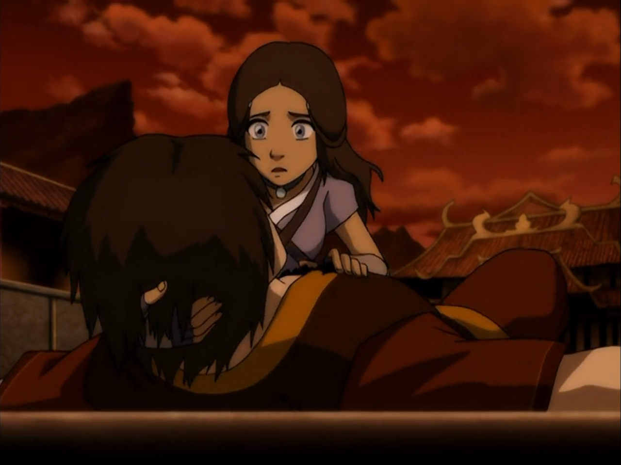 Katara holds Zuko after healing his wounds.