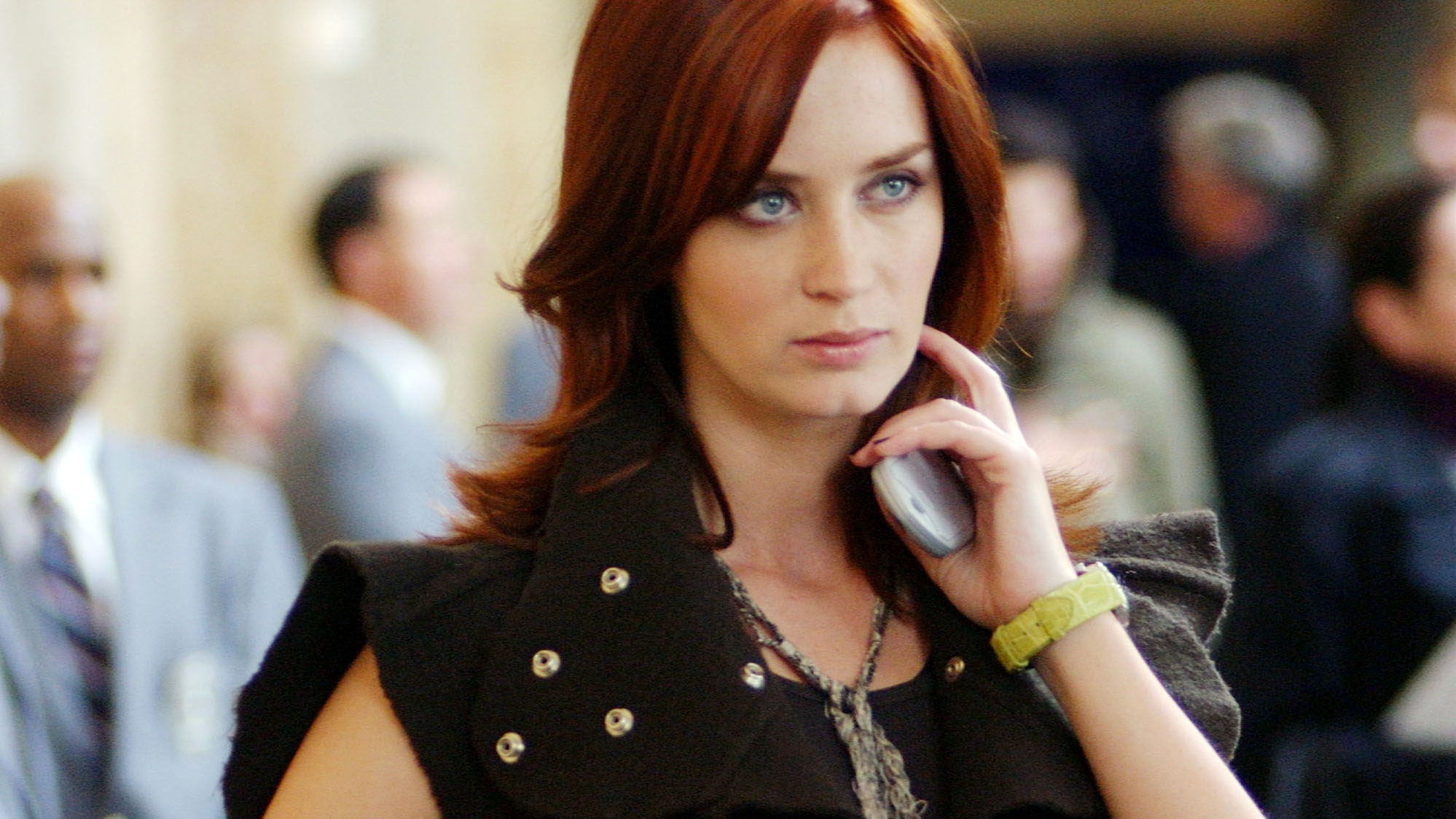 Emily Charlton looking determined with her cell phone in her hand in The Devil Wears Prada (2006).